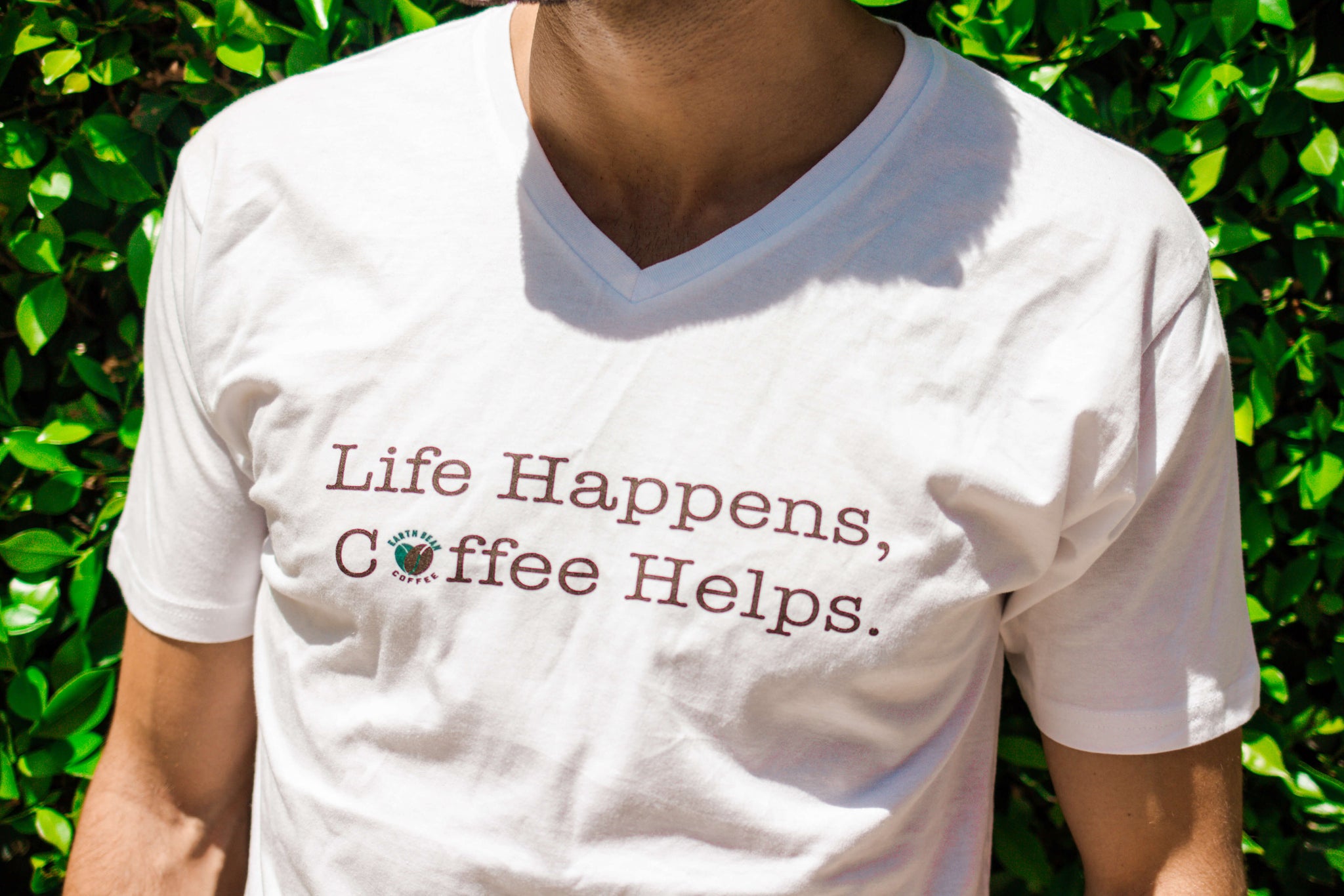 "Life Happens, Coffee Helps." Unisex Tee